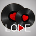 Two Realistic Black Vinyl Records with red heart labels, word love and play button. Retro Sound Carrier on gray background Royalty Free Stock Photo