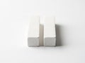 Two rectangular blocks of concrete on a plain surface Royalty Free Stock Photo