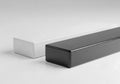 Two rectangular blocks one white and one black on a plain surface Royalty Free Stock Photo