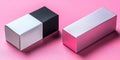 Two rectangular boxes one black and white and one pink on a pink textured surface studio shot Royalty Free Stock Photo