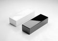 Two rectangular boxes one white and one black placed on a white surface Royalty Free Stock Photo