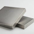 Two rectangular metal plates are stacked. They have a smooth, brushed texture, Royalty Free Stock Photo