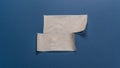 A top-down view of two rectangular strips of semi-transparent masking tape applied to a textured blue background. Royalty Free Stock Photo