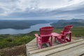 Two Red Adirondack Chairs With a Grand Vista #2 Royalty Free Stock Photo