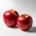 Two red apples are positioned side by side on a white background Royalty Free Stock Photo