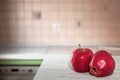 Red apples with water drops on a white table in the kitchen Royalty Free Stock Photo