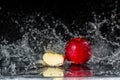 Two red apples in water splash Royalty Free Stock Photo