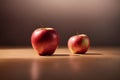 Two red apples on a wooden table with a light brown background. Royalty Free Stock Photo