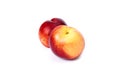 Two red bald peaches on white background. Peaches closeup red color