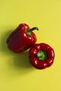 Two red bell peppers on colorful background. Royalty Free Stock Photo