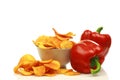 Two red bell peppers and paprika chips Royalty Free Stock Photo