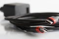 Two red-black usb type-c connectors and black braided wire on a light background next to the power supply. Device for charging Royalty Free Stock Photo