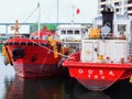 Two red boats ducked adjacent at the pier Royalty Free Stock Photo