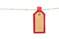 Two red and brown paper tags hanging on the rope by heart shape Royalty Free Stock Photo