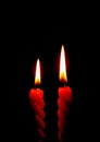 Two Red Candles Burning On the Black Background Royalty Free Stock Photo