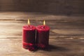 Two red candles tied with red ribbon, the symbol of Valentine`s day, mimics the relationship of men and women Royalty Free Stock Photo