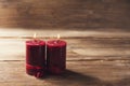 Two red candles tied with red ribbon, the symbol of Valentine`s day, mimics the relationship of men and women Royalty Free Stock Photo