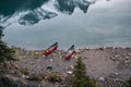 Two red canoe parked on coastline in Maligne lake Royalty Free Stock Photo