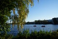 Two red catamarans sail along the Dahme River near Schlossinsel Island. 12557 Berlin, Germany