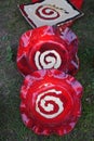 Two red ceramic plates with a white spiral drawn resting on the grass and very typical of Galicia, Spain Royalty Free Stock Photo