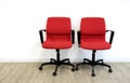 Two red chairs in office