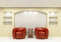 Two red chairs with table in empty library Royalty Free Stock Photo