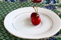 Two Red cherries on a plate Royalty Free Stock Photo