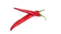 Two red chili peppers lying on a white background. Chilli pepper ready to cook Royalty Free Stock Photo