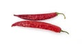 Two red chili peppers lying on a white background. Chilli pepper ready to cook Royalty Free Stock Photo