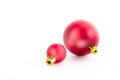 Two red christmas balls ornaments on white background Royalty Free Stock Photo