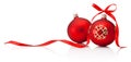 Two red Christmas baubles with ribbon bow isolated on white background Royalty Free Stock Photo