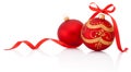 Two Red christmas decoration balls with ribbon bow isolated Royalty Free Stock Photo