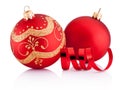 Two Red Christmas decoration baubles and curling paper isolated Royalty Free Stock Photo