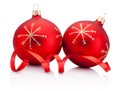 Two red Christmas decoration baubles and curling paper Isolated on white background Royalty Free Stock Photo
