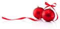 Two red Christmas decoration baubles with ribbon bow isolated on Royalty Free Stock Photo