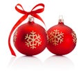 Two red Christmas decoration baubles with ribbon bow isolated on white background Royalty Free Stock Photo