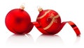 Two red Christmas decoration baubles and shiny curling ribbon Isolated on white background Royalty Free Stock Photo