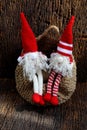 Two red Christmas gnome ornament relax together, cute handmade stuffed toy for decoration Royalty Free Stock Photo