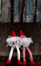 Two red Christmas gnome ornament relax together, cute handmade stuffed toy for decoration Royalty Free Stock Photo