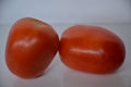 Two red colour bright tomato are fresh and nutritious Royalty Free Stock Photo