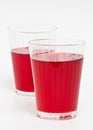 Two red cranberry fruit drinks Royalty Free Stock Photo