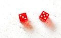 Two red craps dices showing Easy Eight number 3 and 5 overhead shot on white board