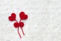 Two red crochet wool hearts and ribbon on white crochet background. The concept for 14 February, romantic Valentine day. Love Royalty Free Stock Photo