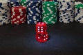 Two red dice on the background of the poker game Royalty Free Stock Photo