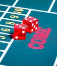 Two red dice on green gambling game Royalty Free Stock Photo