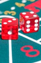 Two red dice on green gambling game Royalty Free Stock Photo