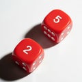Two red dice rolling on a surface Royalty Free Stock Photo