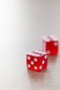 Two Red Dices Isolated on Desktop Royalty Free Stock Photo