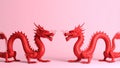 Two red dragons facing each other on a pink background, Chinese New Year concept Royalty Free Stock Photo