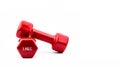 Two red dumbbells isolated on white background with copy space for text. 3.0 kg dumbbell. Weight training equipment. Bodybuilding Royalty Free Stock Photo